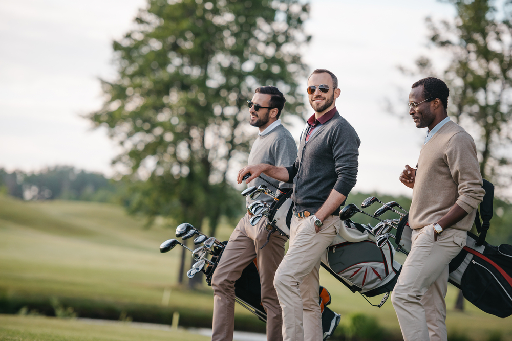 Don't shy away from outdoor activities. Instead, glam them up. Playing golf.